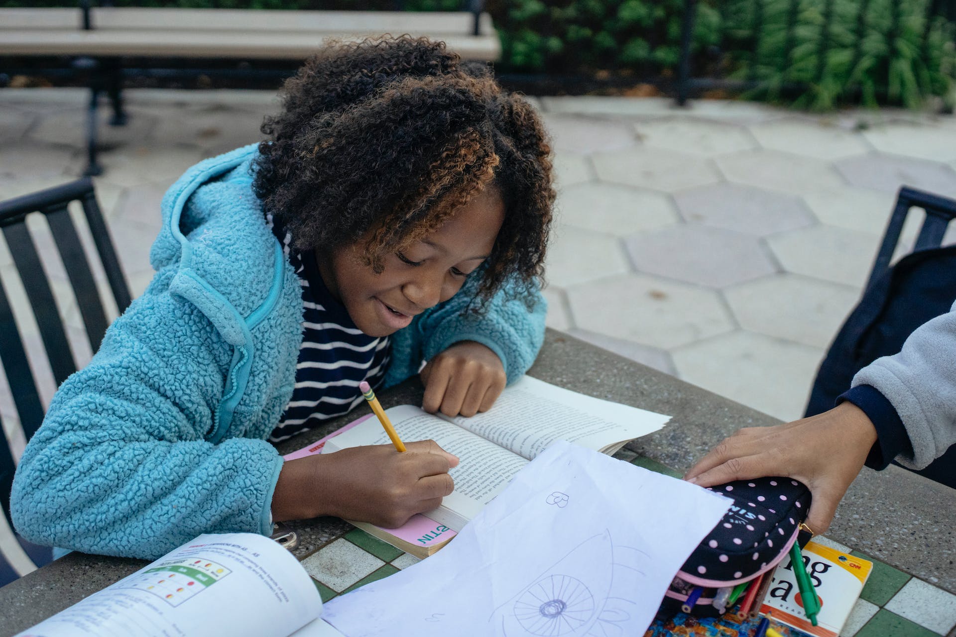 Student working on homework outdoors